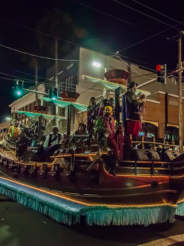 A lit-up pirate ship float rolling through Ybor City during the Gasparilla Knight Parade